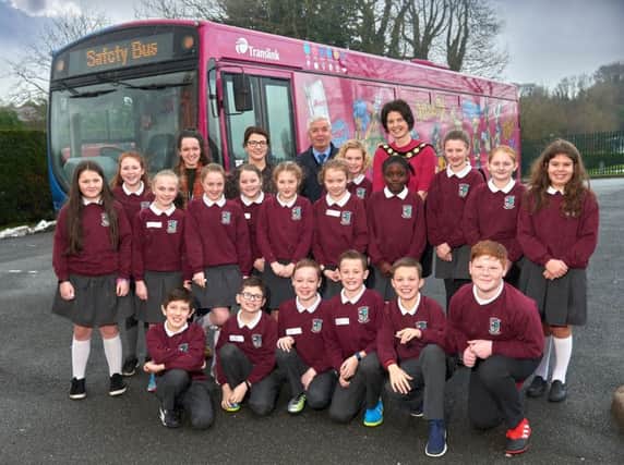 Chair of Mid Ulster District Council, Councillor Kim Ashton is pictured with Cookstown Primary School pupils and the Translink Safety Bus at the recent Bee Safe event.