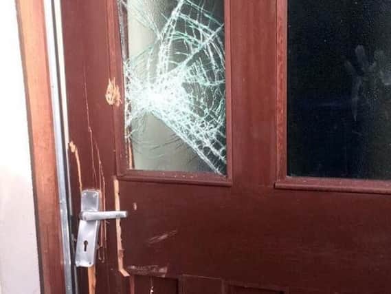 Door smashed during police raid