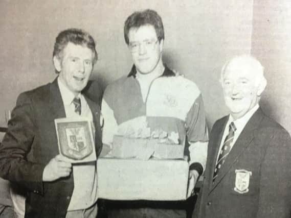 Portadown club captain Danny Forsythe made his farewell appearance for the first fifteen in 1988. After the match he was presented with awards to mark his 12 years at the club. He is pictured with Bobby McKinney and Ken Irwin