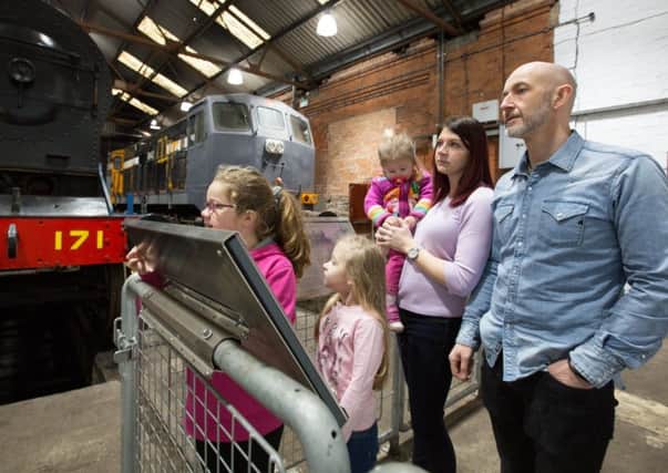 A family enjoying the now award-winning Whitehead Railway Museum which opened last October