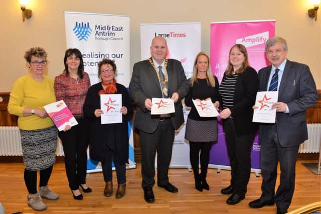 David Gillespie (right) and Hazel Bell (left), representing Ledcom  with representitives from Mid and East Antrim Borough Council (from left)  Councillor Ruth Wilson, Councillor Gerardine Mulvenna, Mayor, Councillor Paul Reid, Gail Kelly and Zoe Lindsay at the official launch of the 2018 Larne Business Awards in Larne Town Hall. INLT 06-006-PSB