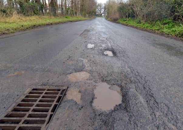 Some of the major potholes on Lisnisky Lane. INPT07-214.