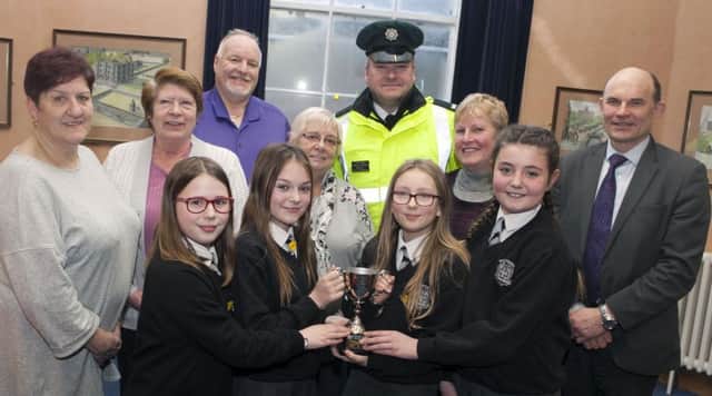 Pupils from Victoria PS, Mary, Ruby, Sophie and Molly, who won the Carrickfergus Road Safety  Quiz. Included along with their teacher IrenÃ© Moffett are Road Safety Committee members, Beryl McKnight, Isobel Day, Patricia Johnston, David Hilditch MLA (RSC chairman), PSNI road safety officer Sydney Henry and Roy Beggs MLA.