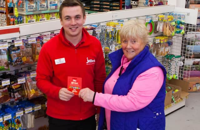 Ryan Godfrey, Manager Jollyes Pet Superstore located in Coleraine, makes donation of Â£750 to charity representative Margaret Dimsdale-Bobby, Chairman Causeway Coast Dog Rescue.