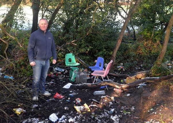 SDLP Councillor, Declan McAlinden pictured at a wooded area adjacent to Tullygally Primary School where anti-social behaviour is taking place. INLM06-203.