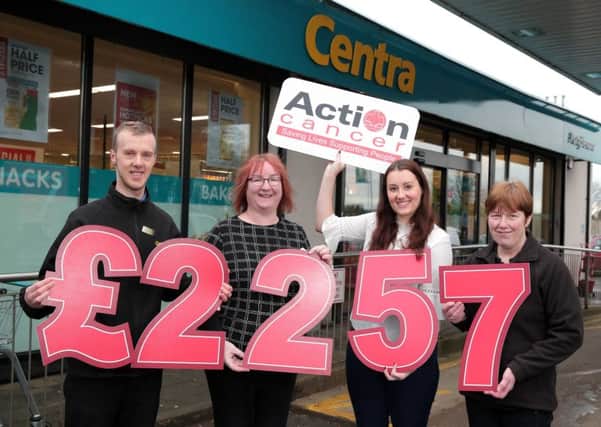 Action Cancers Amy Reynolds (second from right) with Portglenone Centra colleagues (l to r) Kyle Millar, Roberta McKendry and Letty Moore to celebrate raising Â£2257 for Action Cancer during Fundraising Week.