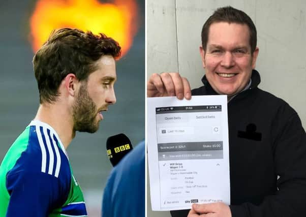 Northern Ireland striker Will Grigg and Neil Gray with his winning bet