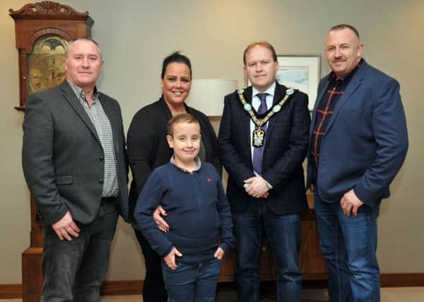 Lord Mayor of Armagh City, Banbridge and Craigavon, Councillor Gareth Wilson and Councillor Declan McAlinden welcome Donna and Stephen Green and son Ryan to Craigavon Civic Centre, to recognise their work for Asthma Awreness, after the death of their eldest son Tiernan last year.