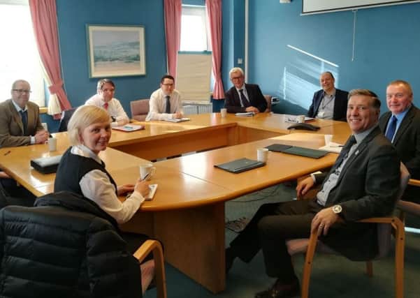 DUP MP Paul Girvan and Community Transport representatives meeting with Department for Infrastructure Permanent Secretary, Peter May.