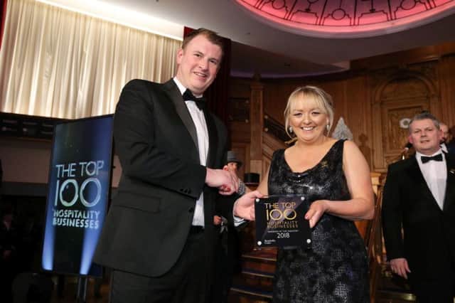 Paul Hanna, Molson Coors and Martha Davis, Matties Meeting House, Cairncastle, at the Top 100 Hospitality Business Awards at Titanic Belfast. Pictures by Kelvin Boyes, Press Eye.