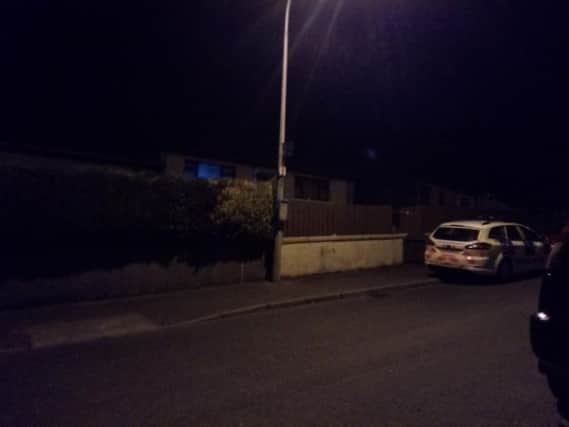 Police car outside the property on Sunday night
