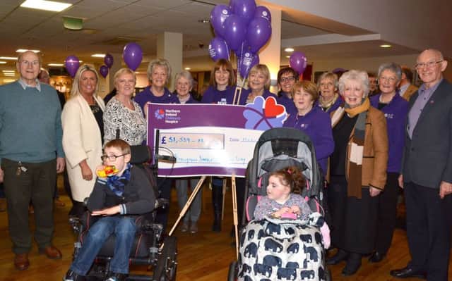 Members of the NI Children's Hospice Ballymena Support Group present Noreen Kennedy, Regional Fund Raising Manager , with a cheque for Â£51,539.28, which was raised from the Jingle All The Way venture.  Included are County Antrim Lord Lieutenant, Mrs. Joan Christie. GB0948R18
