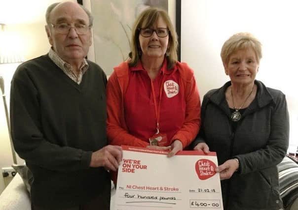 Ross and Myrtle McAuley from Larne, who recently celebrated their 60th Wedding Anniversary, present a cheque for Â£400 to NICHS Community Ambassador Jacqui Seymour.