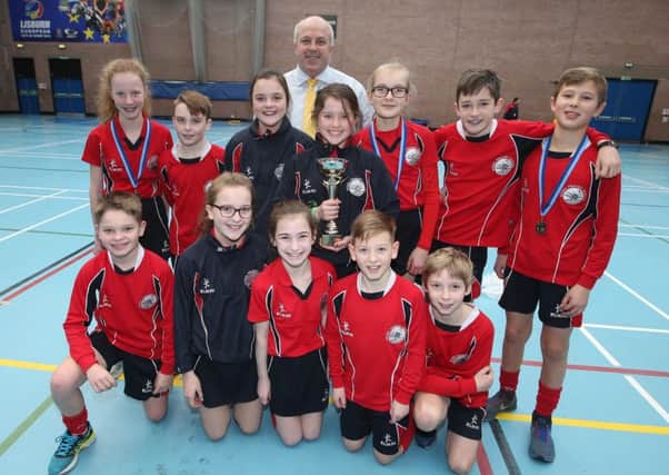 Chairman of Lisburn & Castlereagh City Council's Leisure & Community Development Committee, Alderman James Tinsley is pictured at the recent Sports Hall Athletics competition held at Lagan Valley LeisurePlex with Overall School Winners, Moira Primary School.