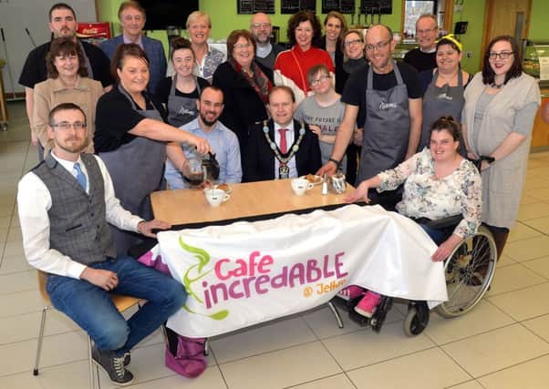 Mayor of ABC Council, Alderman Gareth Wilson, front centre right, pictured at the launch of CafÃ© Incredible at the Jethro Centre, Lurgan, with Nigel Hampton, front centre left, Dolores Kelly, MLA, centre, Andrew Dunlop, front left, Jethro Centre manager and trainers, staff and invited guests. INLM09-200