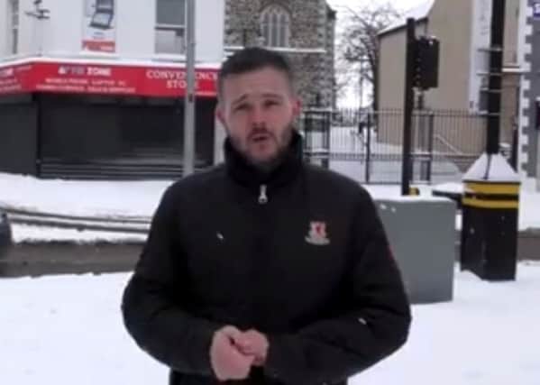 Braving the cold: Robbie Butler MLA in the centre of Lisburn on Thursday morning.