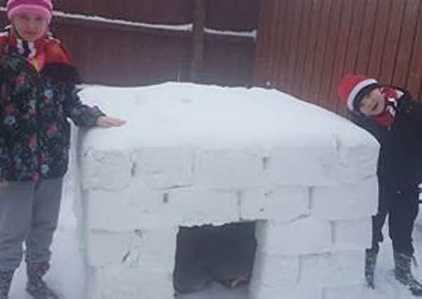 Reece and Amy-Lee Loney at the igloo they built in Lurgan