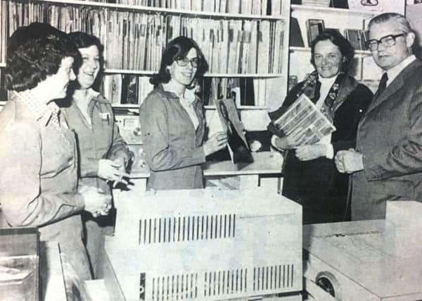 David Mitchell, Minister of the Environment with his wife Pam during a visit to Craigavon Shopping Centre in 1981. They are pictured in Eason's record department with Mrs S Abraham, Mrs C Lyness and Miss C Murphy