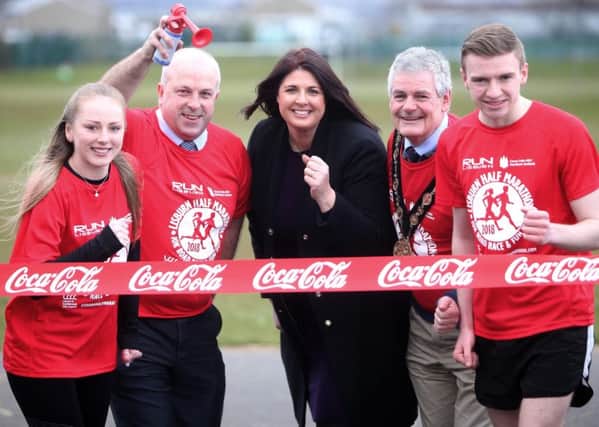 The Mayor of Lisburn & Castlereagh City Council, Councillor Tim Morrow and the Chairman of the Leisure & Community Development Committee, Alderman James Tinsley alongside Gillian Shields, Community Affairs Manager from Coca-Cola HBC Northern Ireland launches the 36th Lisburn Coca-Cola HBC Half Marathon, 10K Road Race and Fun Run with local runners Ethan Dunn and Grace Millar.