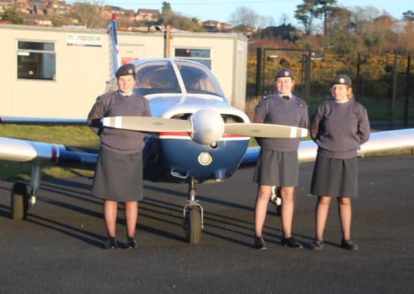 Air Cadets Kayce Wilson, Megan Simpson and Ellie Whiteside, all members of 2241 Squadron, get a closer look at a private aircraft at the Ulster Flying Club. Pic by Tony Osborne