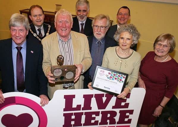 The Magheralin Community Association are pictured receiving their  Community Together Award at the Live Here Love Here Community Awards  from Lord Mayor of Armagh City, Banbridge and Craigavon Borough Council, Gareth Wislon