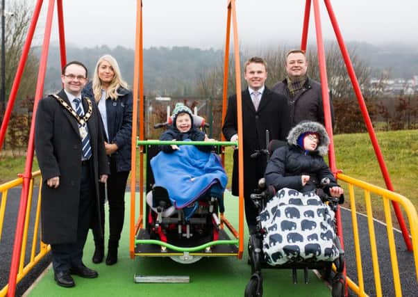 The Mayor, Cllr Paul Hamill officially opens the first wheelchair accessible
swing of its type in the borough. He is pictured with Ellen Boyd (Customer Accessibility Officer), Luke Mullan, Cllr Thomas Hogg, Cllr Robert Foster and Sam McBride.