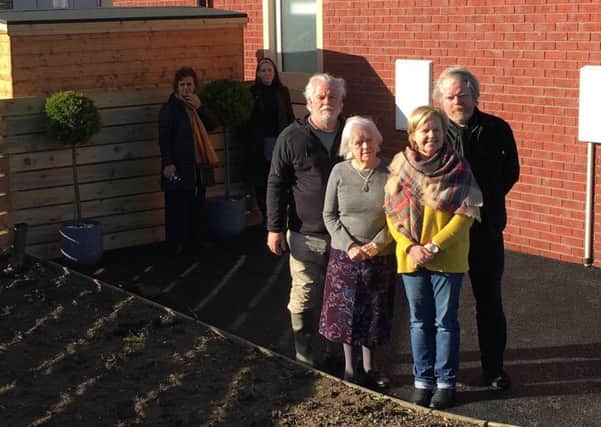 Patricia Lee (front right) is pictured with her mother Elizabeth Doherty (83) with her two sons Paul and Jeffrey Doherty. The missing plants are pictured behind the group.