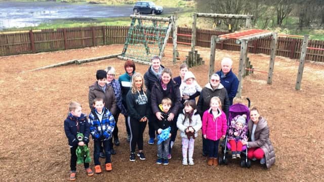 Parents, children, community activists, Paul Frew MLA , Cllr Beth Clyde and Lexie Scott, chairman of Broughshane and District Community Association.