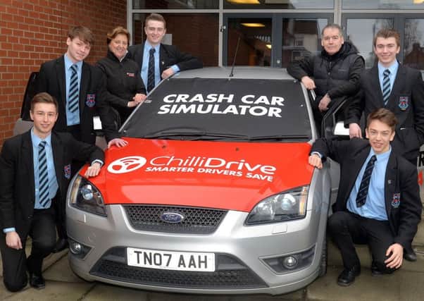 Portadown College had a visit from the Autoline Insurance car crash simulator and students were able to experience what a car crash is really like. Pictured with the simulator are from lrft, Luke Hanvey, Jordan Bingham, Tracey Doherty, Autoline, Ryan Crory, Sam McElroy, Autoline, Brett Hardy. INPT10-201.