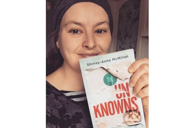 Author Shirley-Anne McMillan with her new book, The Unknowns.