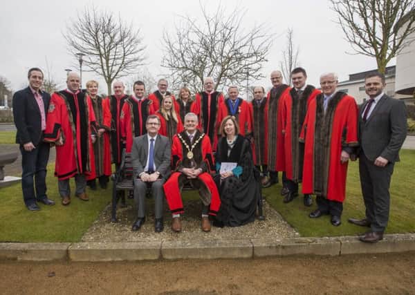 Mayor Tim Morrow, Sir Jeffrey Donaldson MP, council chief executive Dr Theresa Donaldson, Paul Givan MLA, Robbie Butler MLA and aldermen and councillors at the raising of the Commonwealth Flag at Lagan Valley Island on March 12.