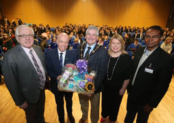 Pictured at the Schools Fairtrade Event at Wallace High School are: (l-r) Alderman Allan Ewart MBE, Chairman of the Council's Development Committee; John Daly; the Mayor, Councillor Tim Morrow; Deborah OHare, Principal of Wallace High School; and Father John Joseph, Fairtrade producer.