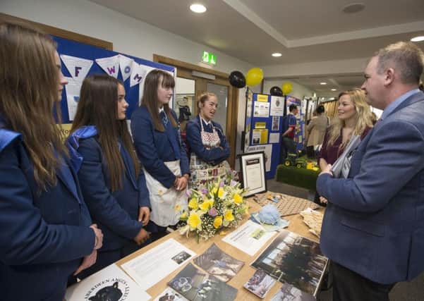 Ballyclare Secondary School pupils Lydia McKeister, Tammy McCammond, Hannah McCartney and Amy-Lee Hanvey and their teacher Miss Sharon Trimble, chat with Charles Smith from the Angus Producers Group at the ABP Angus Youth Challenge held at CAFRE Loughry Campus.