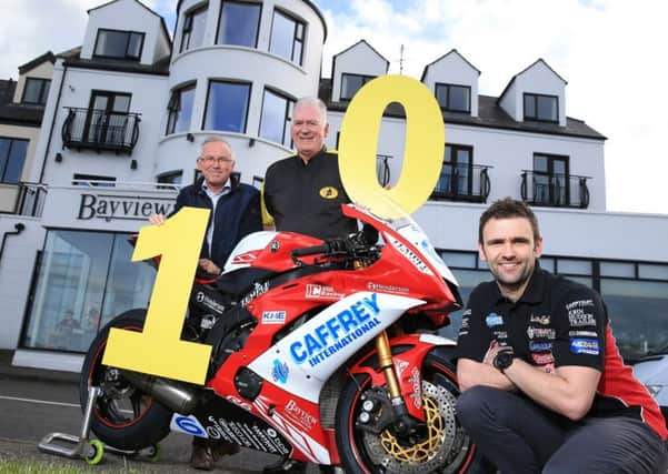 ARMOY Motorcycle Road Racing Club is proud to announce the Bayview Hotel as title sponsor of the Race of Legends 2018. A joint celebration, as both the Race of Legends event and the Bayview Hotel celebrate their 10th anniversary. Pictured (l-r) Owner of the Bayview Hotel, Trevor Kane, Clerk of the Course, Bill Kennedy MBE and road racer William Dunlop.