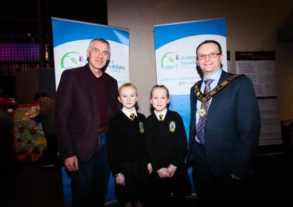 Mayor of Antrim and Newtownabbey, Cllr Paul Hamill is joined by Declan Kearney MLA and Gaelscoil Ã‰anna pupils, Iona Gorman and Meabh McClean at the Irish Language Event at Theatre at The Mill.