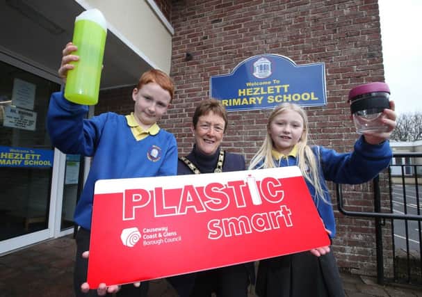 Hezlett Primary School near Castlerock has been named the first plastic-free school in the Causeway Coast and Glens. Pupils Ross and Brooke celebrate the award with the Mayor, Councillor Joan Baird OBE.