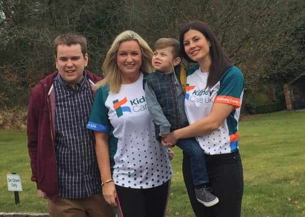 Jo-Anne Dobson, organ donation ambassador and son Mark with Sarah Lamont (right) who is joining the Team Kidney Care UK team running the Belfast Marathon in aid of the charity and her son Joe.