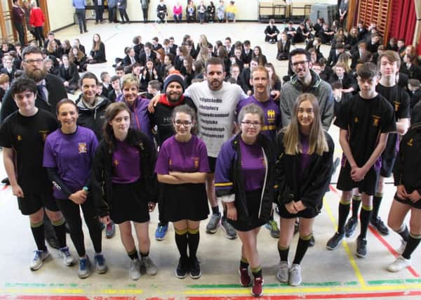 John Hammond (centre back) with staff from Brownlow College, pupils and supporters. Included are teacher Simon Callendar and Cameron's dad Hammy Truesdale.