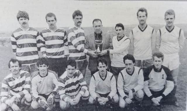 Gerard Logue (centre) with the Peacocks and Linfield Swifts who contested the final of the annual Gerard Logue Memorial Football Competition at St Brecon's School in June 1989.