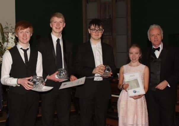 This years winner of 2018 Northern Ireland Young Musician Competition which took place in 
Campbell College, Belfast was Ross Houston from Ballymena (left), who attends the Royal Irish Academy Music.  Ross played the Concertino by Chaminade on concert flute. He is pictured with runner-up Jamie Howie, Rory Masterson who was placed third and Aoife Downey,  the most promising under-sixteen year-old and TV Presenter Noel Thompson (MC)