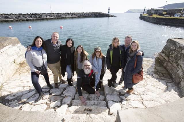 Tour guide, Flip Robinson (front centre), showing Australian travel agents the beautiful Causeway Coastal Route, including Carnlough Harbour.  The agents were guest of Tourism Ireland, Tourism NI and Etihad Airways.
Pic by Paul Faith.