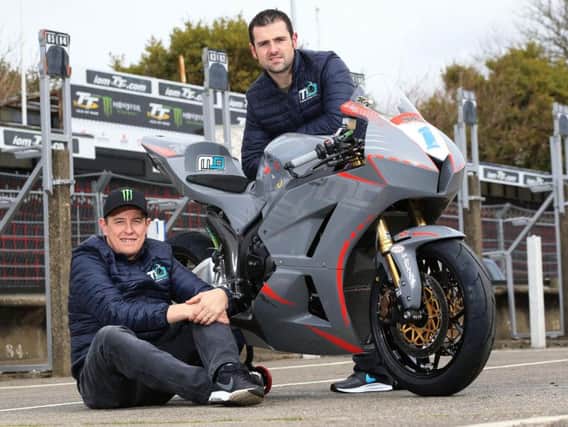 Michael Dunlop and John McGuinness with the MD Racing Honda Supersport machine on the Isle of Man on Wednesday.
