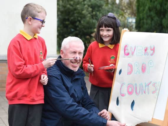 NI Water is celebrating World Water Week by launching its annual schools competition, 'Every Drop Counts'.  Pictured launching the competition are P5 pupils Lola Brown and Ruairi Diver with NI Water's Pat McCauley.