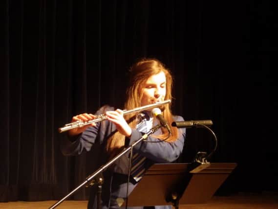 Annie Levy performing a flute solo at the Loreto College Spring Concert