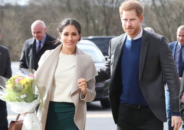 Prince Harry and Meghan Markle arrive for a visit to the Eikon Exhibition Centre in Lisburn where they attended an event to mark the second year of youth-led peace-building initiative Amazing the Space.