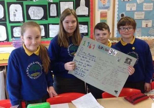 Camphill pupils pictured with their research into the year of their school's opening - 1967.