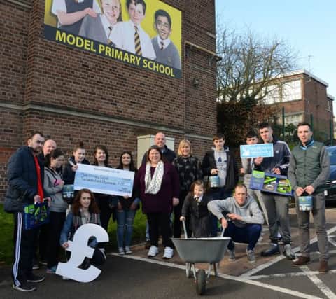 Students on North West Regional College's Princes Trust Training programme present a cheque for Â£250, and gardening equipment, to Model Primary School principal Michelle Ramsey, and local mum Ann Marie Coyle who is raising money for a sensory unit at the school. Also included are Conor Hassan and Sean Curran, North West Regional College.