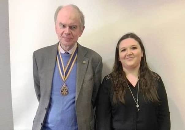 Rachael Creighton of Crossroads Care with Carrickfergus Rotary Club President Jim Dunlop.