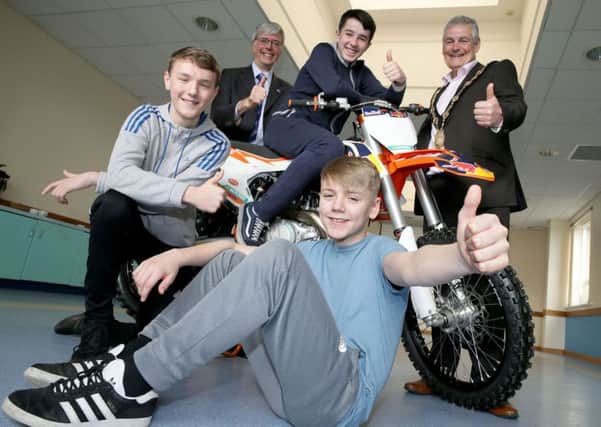 Brian Grzymek, Department of Justice, and Mayor Tim Morrow joined Ciaran McShane, Jack Boyd and Craig Belshaw to celebrate their completion of the inaugural UGP Motorbike Awareness Project. Pic by Srephen Davison, Pacemaker