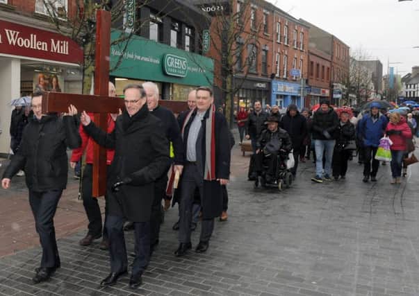 The Rt Rev Dr Noble McNeely (Moderator of the General Assembly) pictured with Lisburn City Centre Clergy at the Good Friday carrying of the cross walk of witness in Lisburn.
